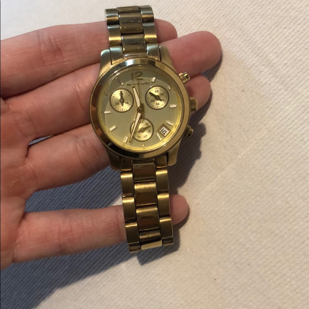 Michael lots gold watch